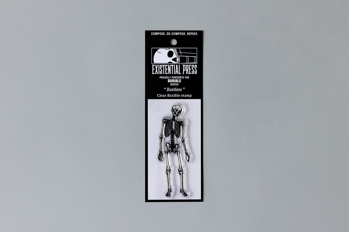 Restless skeleton stamp on Existential Press Burials packaging card