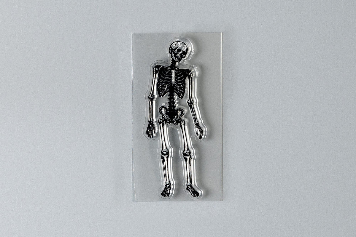 Restless skeleton clear stamp on backing sheet